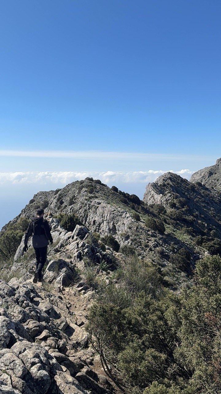 Hiking backpack and technical footwear on La Concha rocky climb Marbella